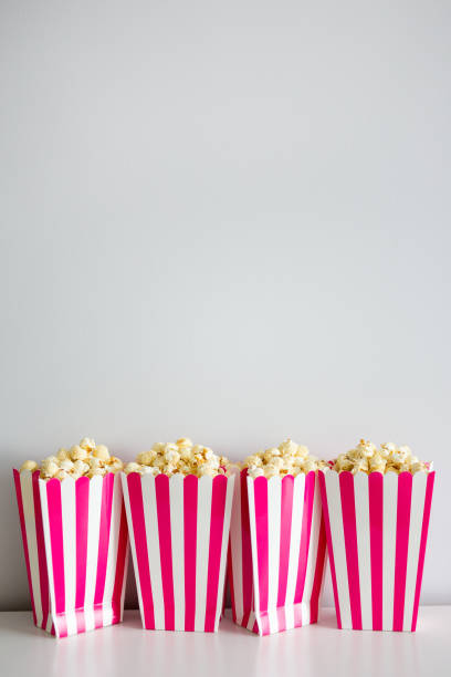 istock popcorn in striped boxes and copy space over white background 1278406653