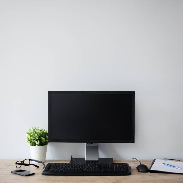 istock modern workplace with computer, flower pot, glasses, clipboard and pen 1278406792