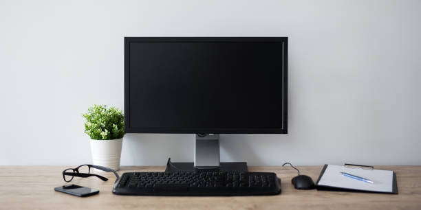istock modern workplace with computer, flower pot, glasses, clipboard and pen - copy space in blank screen 1278406793