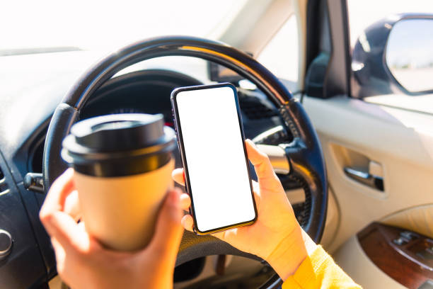 istock woman drinking hot coffee takeaway cup inside a car and using smartphone 1278409962
