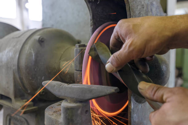 istock The worker is grinding to drill bit with bench grinder machine in the workshop. A bench grinder is a benchtop type of grinding machine used to drive abrasive wheels. 1278410557