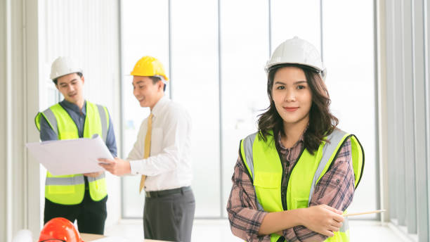 istock Portrait of confident female construction worker at construction site in office. 1278418576
