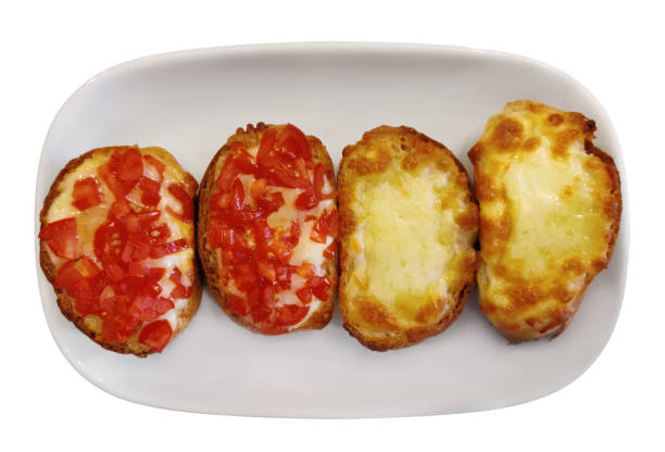 close up of italian bruschetta bread with cheese, tomato and garlic, serving on white plate. isolated on white background - mozzarella tomato sandwich picnic imagens e fotografias de stock