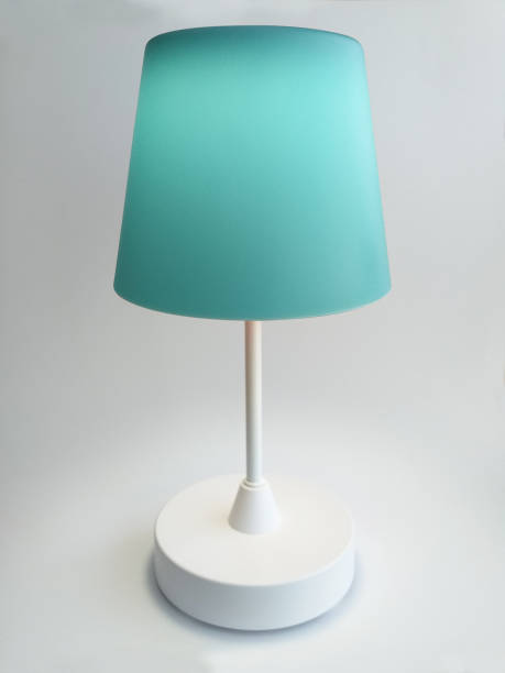 istock Blue Touch Table Lamp turned on with warm light isolated on white background. Interior lighting and home decoration design object. 1278424652