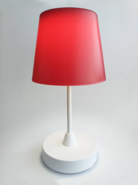 istock Red Touch Table Lamp turned on with warm light isolated on white background. Interior lighting and home decoration design object. 1278424658