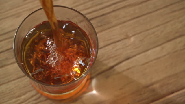 Top view of Tea pouring in glass