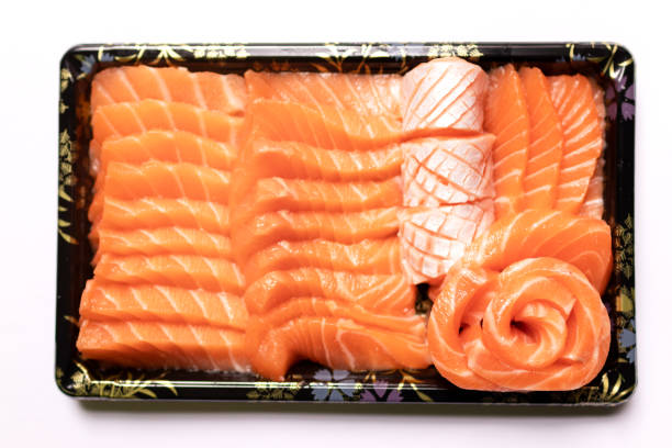 istock Fresh salmon sashimi serve on take a way tray isolated on white background. 1278426233