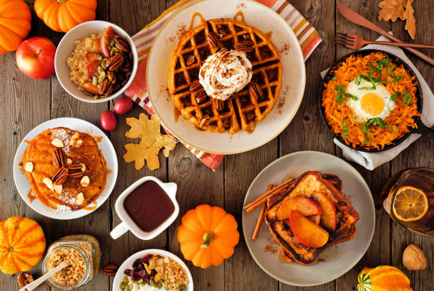 istock Autumn breakfast or brunch buffet table scene against a dark wood background. Overhead view. 1278427299
