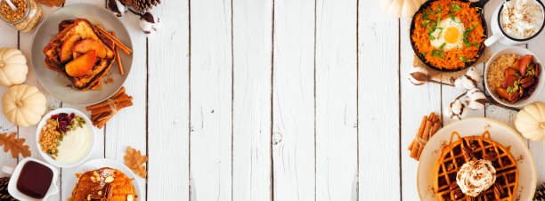 Fall breakfast or brunch buffet double border against a white wood banner background. Top view with copy space.