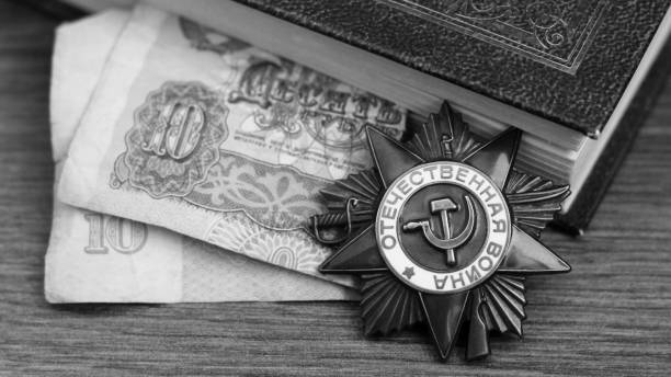 istock Victory Day Star Order, a book and retro money 1278427761