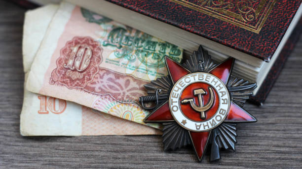 istock Victory Day Star Order, a book and retro money 1278427852