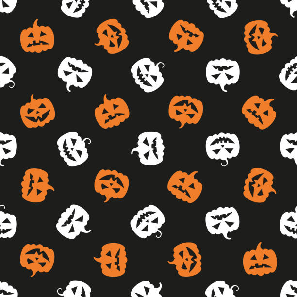 istock Scary orange and white pumpkin heads seamless pattern on a black background. Halloween holiday ornament. Vector illustration easy to edit and customize. Eps10 1278429120