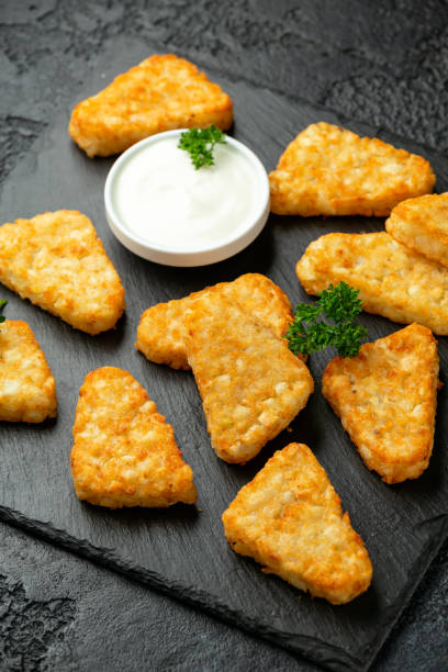 istock Hash brown potato patties on rustic stone board 1278430431