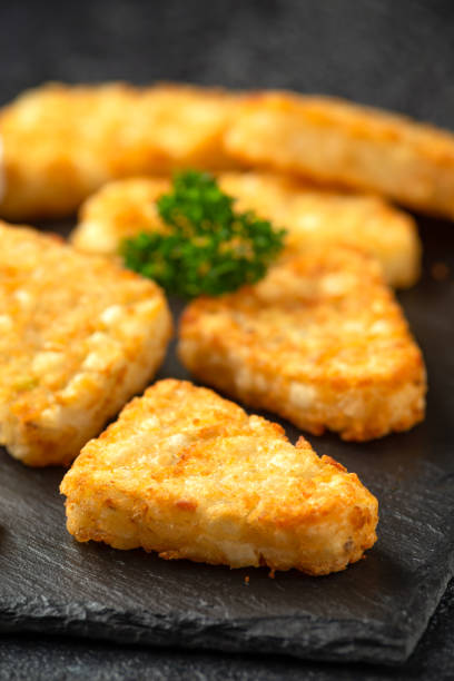 istock Hash brown potato patties on rustic stone board 1278430462