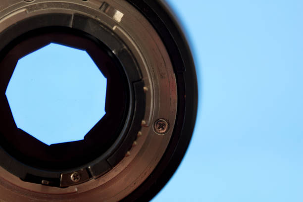 istock close-up. photography lens with shutter, blue background 1278430539