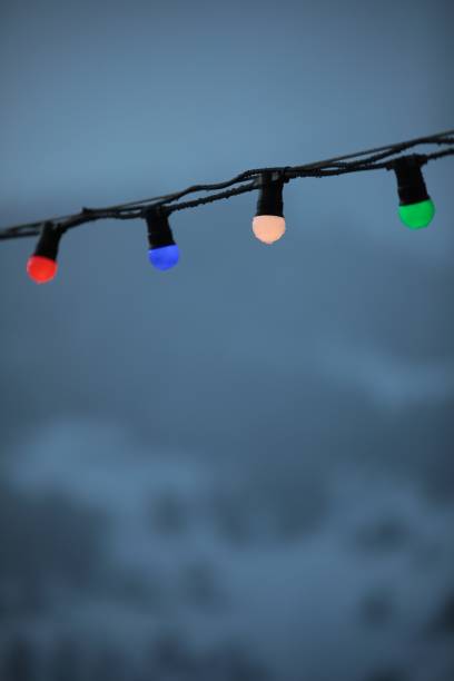 istock Pretty decorative lights hanging from a cable against a backdrop of misty mountain landscape 1278430965