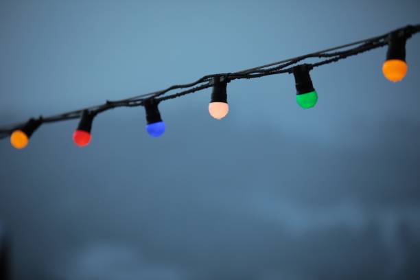 istock Pretty decorative lights hanging from a cable against a backdrop of misty mountain landscape 1278430970