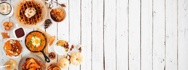 istock Fall breakfast or brunch buffet side border against a white wood banner background. Top view with copy space. 1278431820