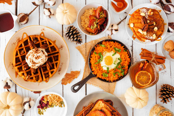 istock Autumn breakfast or brunch buffet table scene against a white wood background. Top view. 1278431996