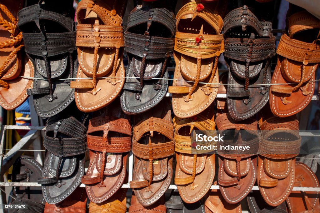 Indian famous traditional men leather footwear Indian famous traditional men leather footwear closeup Kolhapur Stock Photo