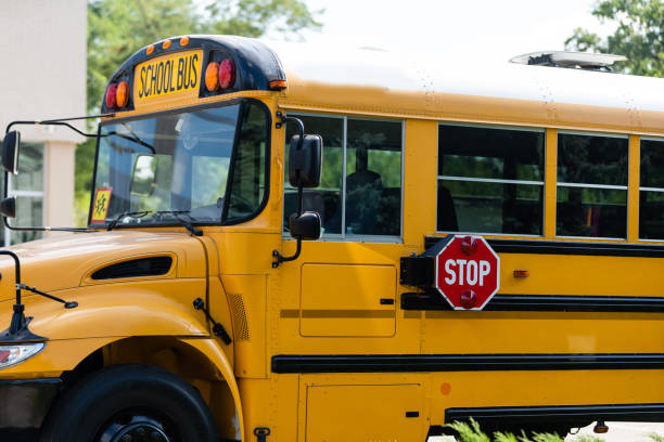 istock Yellow school bus on the street 1278436061