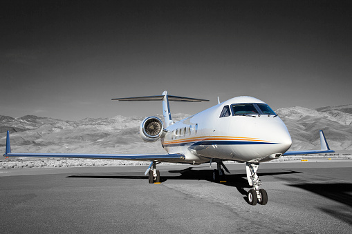 Gulfstream G-V at Bishop Airport (KBIH) Bishop, California, USA.  Gulfstream G-V has a crew of 4 and can carry up 14 passengers.  G-V wingspan is 93 feet.  G-V Ceiling Height is 51,000 feet.  G-V has a 6,500 mile range.