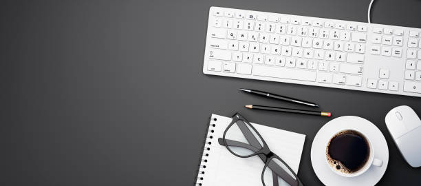 istock Top view of a dark desktop with copy space 1278436426