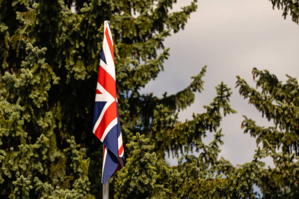 istock Great Britain flag against blue sky 1278437356