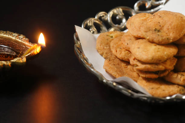 istock Diwali lamp with indian snack mathari 1278439430