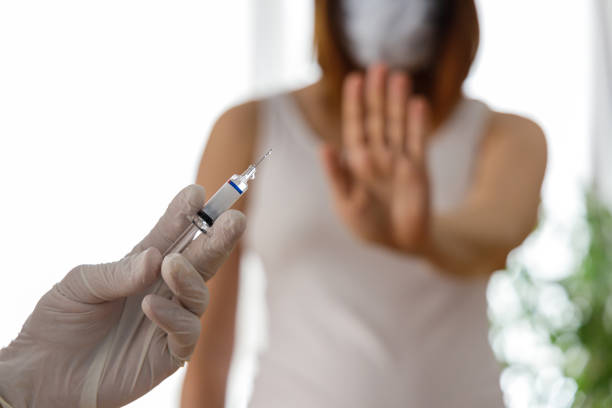 istock Woman wearing mask is against vaccination 1278439781