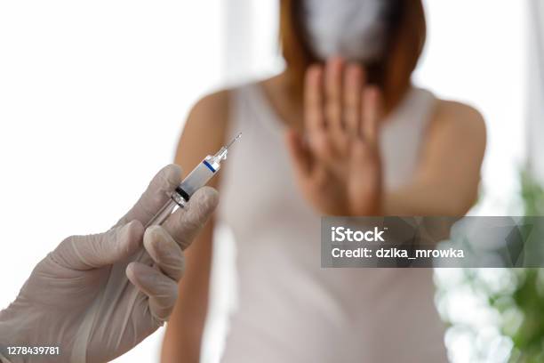Woman Wearing Mask Is Against Vaccination Stock Photo - Download Image Now - Vaccination, Rebellion, Fear