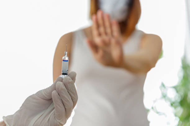 istock Woman wearing mask is against vaccination 1278439784