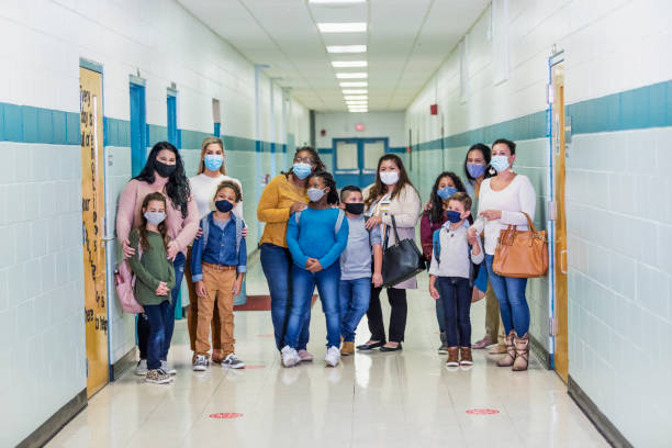 istock Mothers with children, back to school during covid-19 1278439821