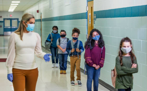 istock Students in school during covid-19, wearing masks 1278440053