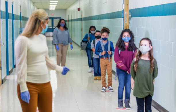 istock Students in school during covid-19, wearing masks 1278440055