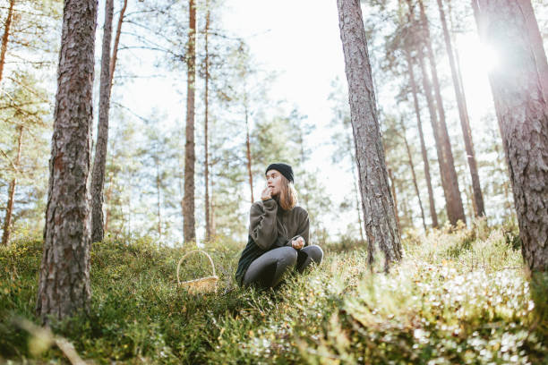istock Woman picking berries on sunny day 1278440422