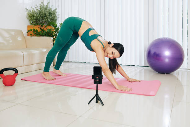 istock Blogger conducting online yoga class 1278441744