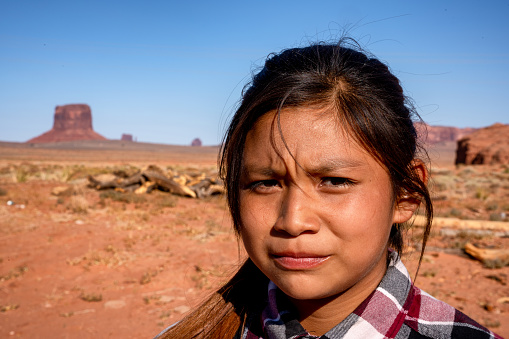 Outdoor Portrait of a beautiful Navajo Native American Indian Girl in the Northern Arizona Desert on the Monument Valley Indian Reservation