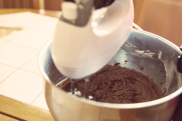 istock Mixing Chocolate cheese cream for cakes with a mixer 1278443217