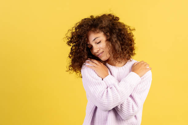 istock Young african american woman on yellow copy space background 1278445189