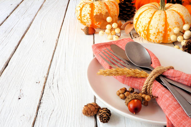 istock Harvest or thanksgiving table setting close up against a white wood background 1278446449
