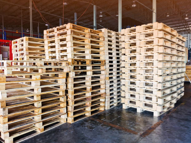 istock Worker driving forklift to loading wooden pallets from truck to warehouse cargo storage, shipment in logistics and transportation industrial, wood pallets stack, delivery service 1278451298