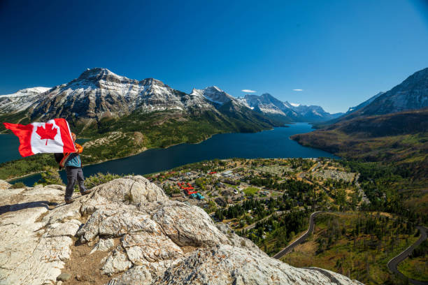 istock Waterton Lakes National Park and man with Canada flag 1278453083