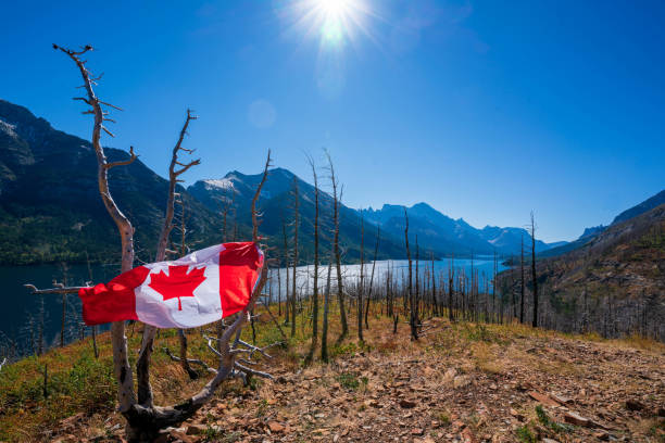 istock Waterton Lakes National Park and man with Canada flag 1278453130