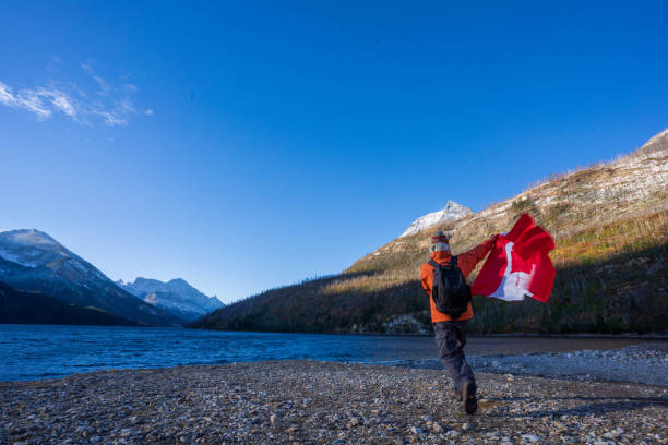 istock Waterton Lakes National Park and man with Canada flag 1278453155
