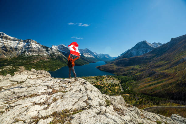 istock Waterton Lakes National Park and man with Canada flag 1278453270