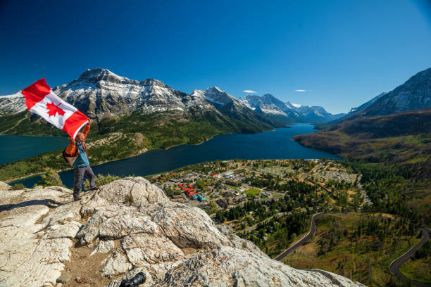 Waterton Lakes National Park and man with Canada flag