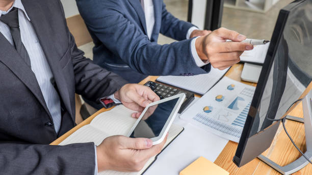 istock Business team investment working with computer, planning and analyzing graph stock market trading with stock chart data, business financial investment and technology concept 1278454413