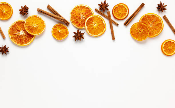istock Christmas composition with dried oranges, cinnamon sticks and herbs 1278457075