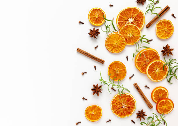 istock Christmas composition with dried oranges, cinnamon sticks and herbs 1278457104